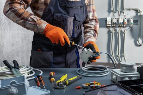 Electrician working on power switch